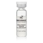 DERMOTECHNOLOGY® Brightening Serum vial, a bioactive serum designed to lighten and even out skin tone.
