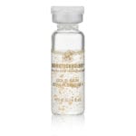 DERMOTECHNOLOGY® Gold Skin Repair Serum vial with gold flakes for luxurious skin rejuvenation and repair.