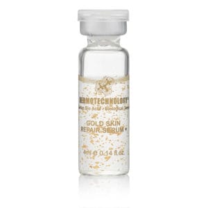 DERMOTECHNOLOGY® Gold Skin Repair Serum vial with gold flakes for luxurious skin rejuvenation and repair.